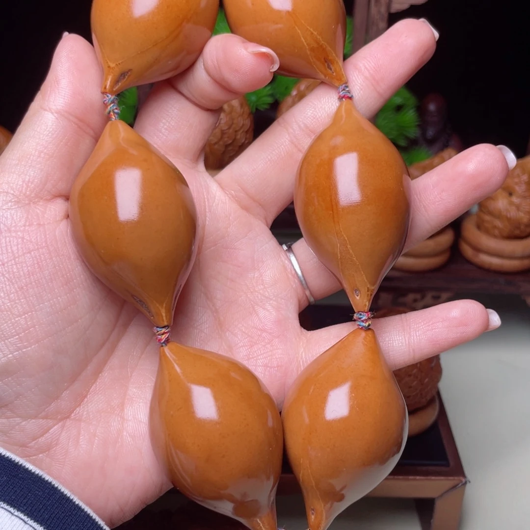 吊坠橄榄核长光珠手持