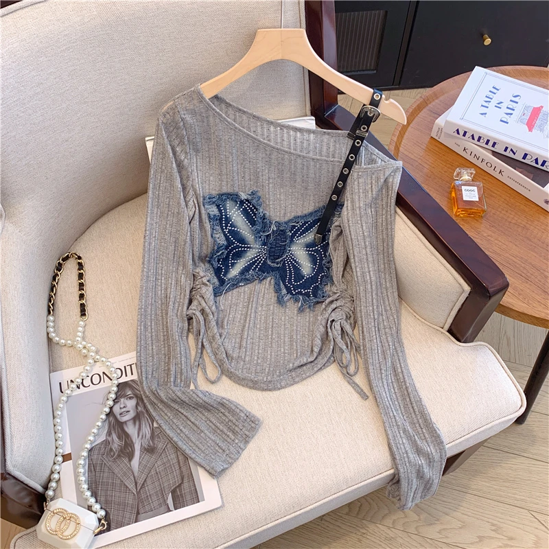 甜酷风牛仔蝴蝶贴布针织衫女春季款纯欲露肩小衫韩版抽绳收腰上衣