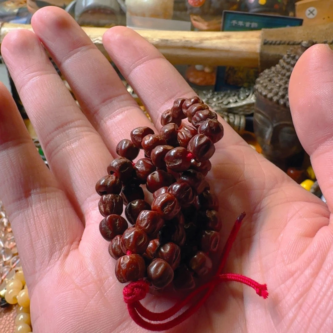 老老百香籽手持扎西德勒