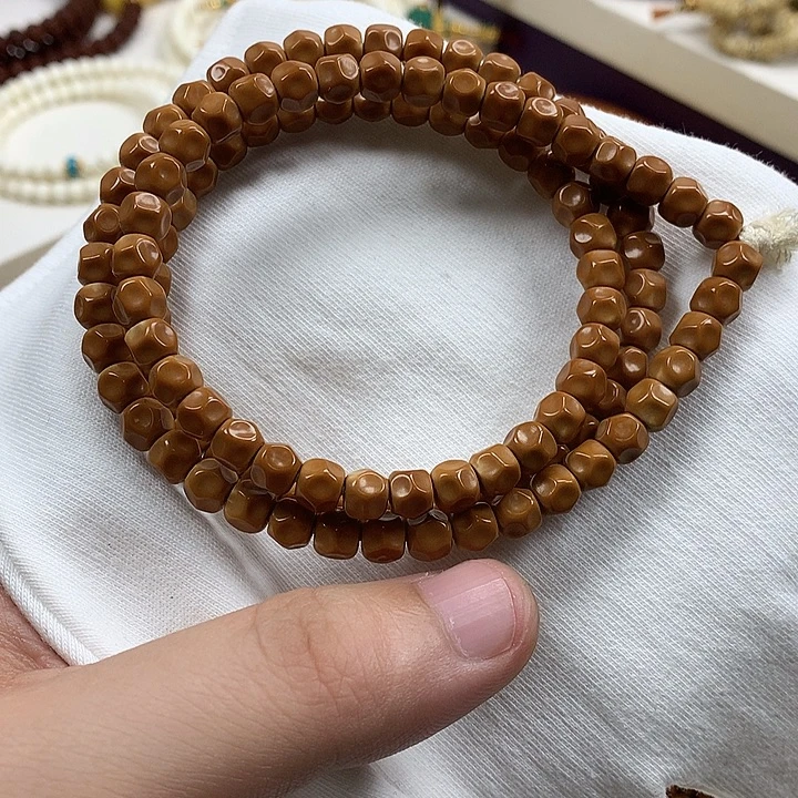 橄榄核手串玩家回置核尖