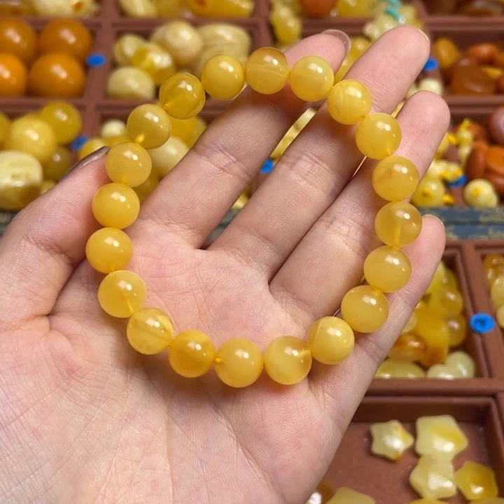 柠***桃蜜蜡未镶嵌珠宝奇石无优化圆珠手串（天然蜜蜡微花粉）