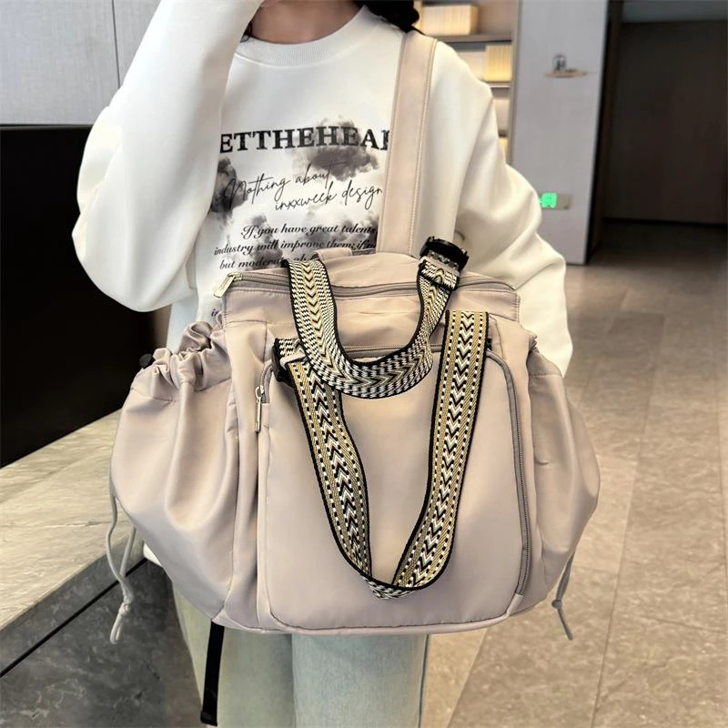 FAVMARTHA百变摇篮旅行大容量多功能时尚手提双肩包2025母婴外出