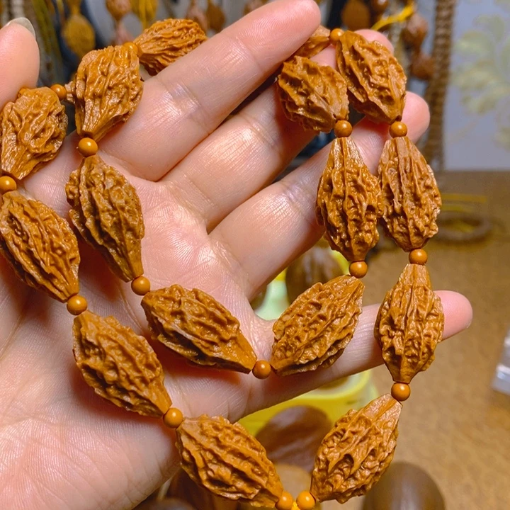 野生麒麟眼橄榄核手持18颗