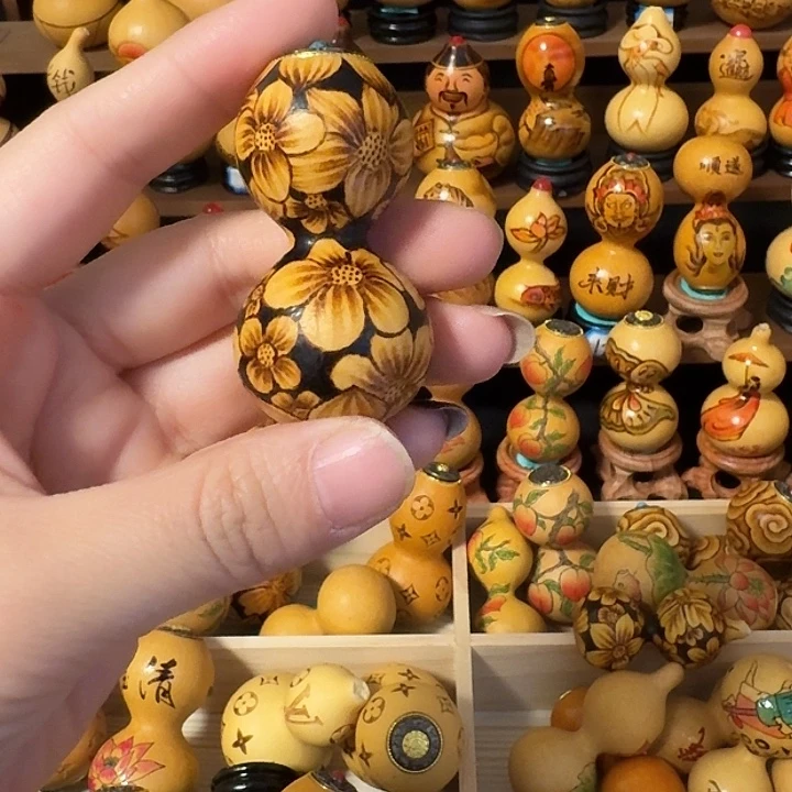 瑄***陶瓷葫芦绕指手把件