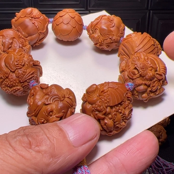 李***号橄榄核手串八星报喜