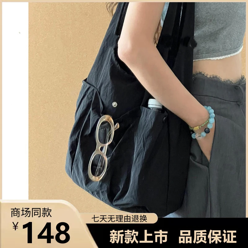 帆布包包女式2025新款超火简约休闲轻便托特包通勤百搭单肩水桶包