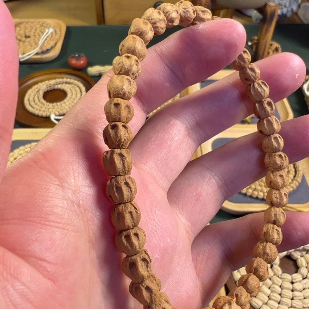 【闪购商品】柏香籽/百香籽吊坠热振双坑对眼狮驼林手持2号