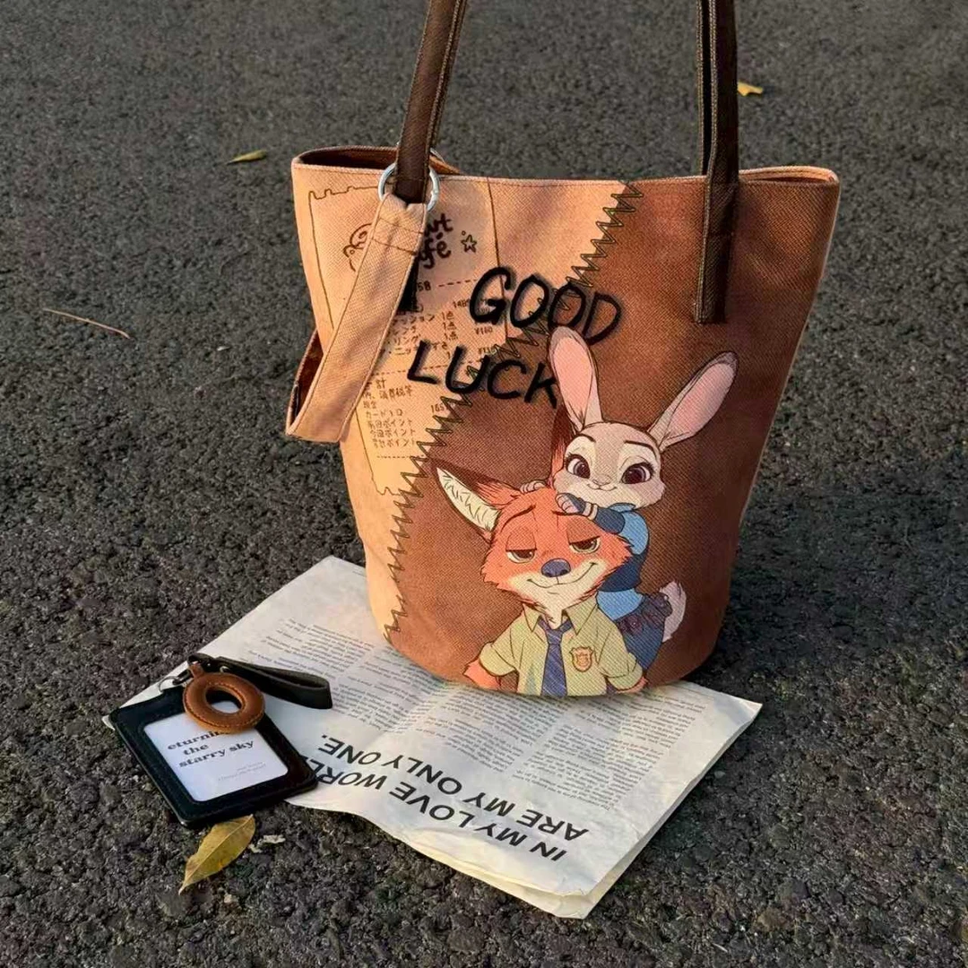 秋冬可爱插画百搭单肩包撞色水桶包大容量日常通勤休闲妈咪帆布包