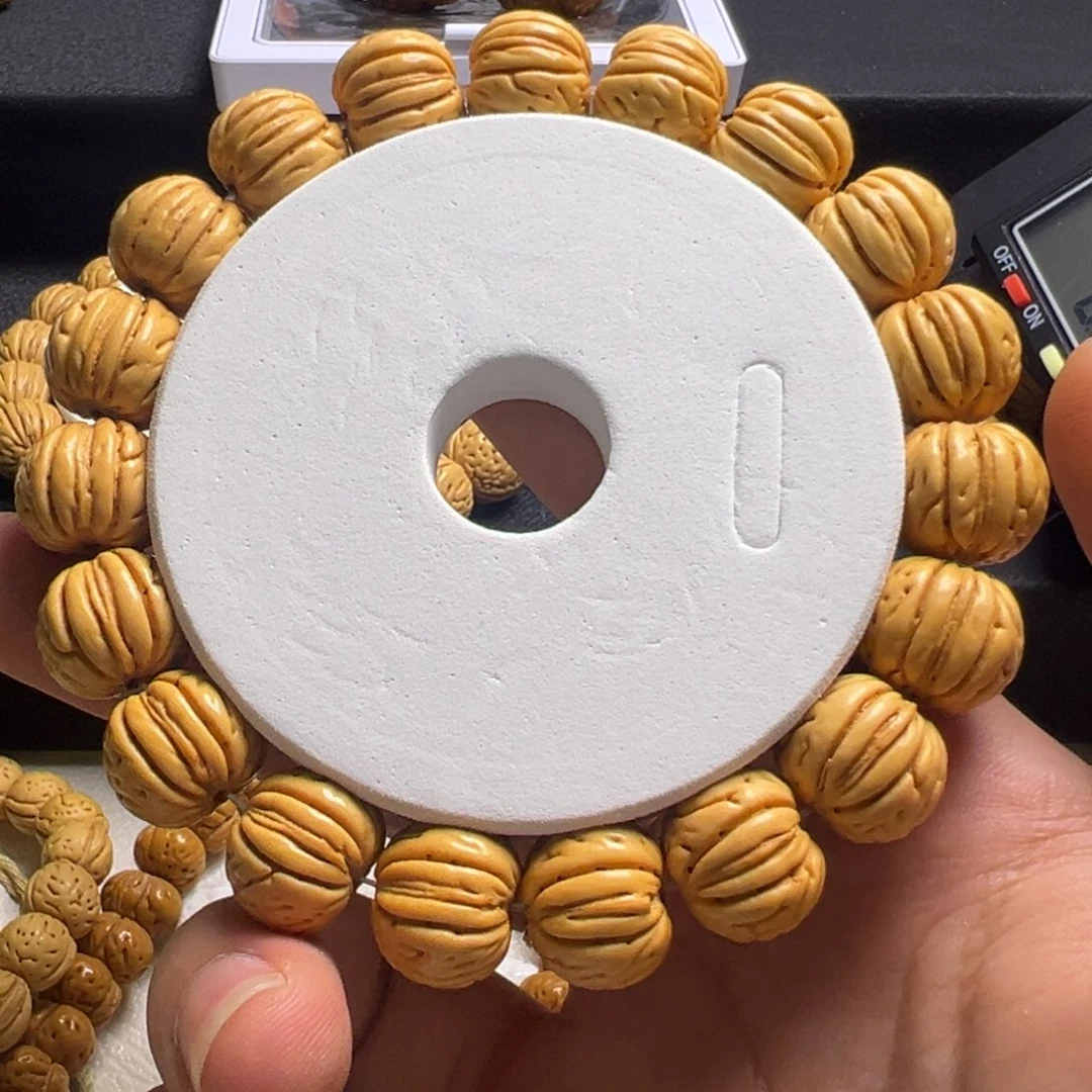 吉***.桃核吊坠14金丹桃核