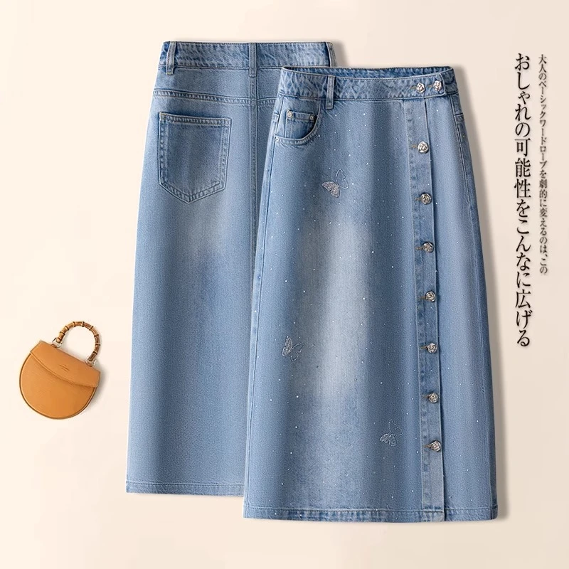 夏季薄款天丝牛仔半身裙女2025年新款蝴蝶烫钻重工开叉a字中长裙
