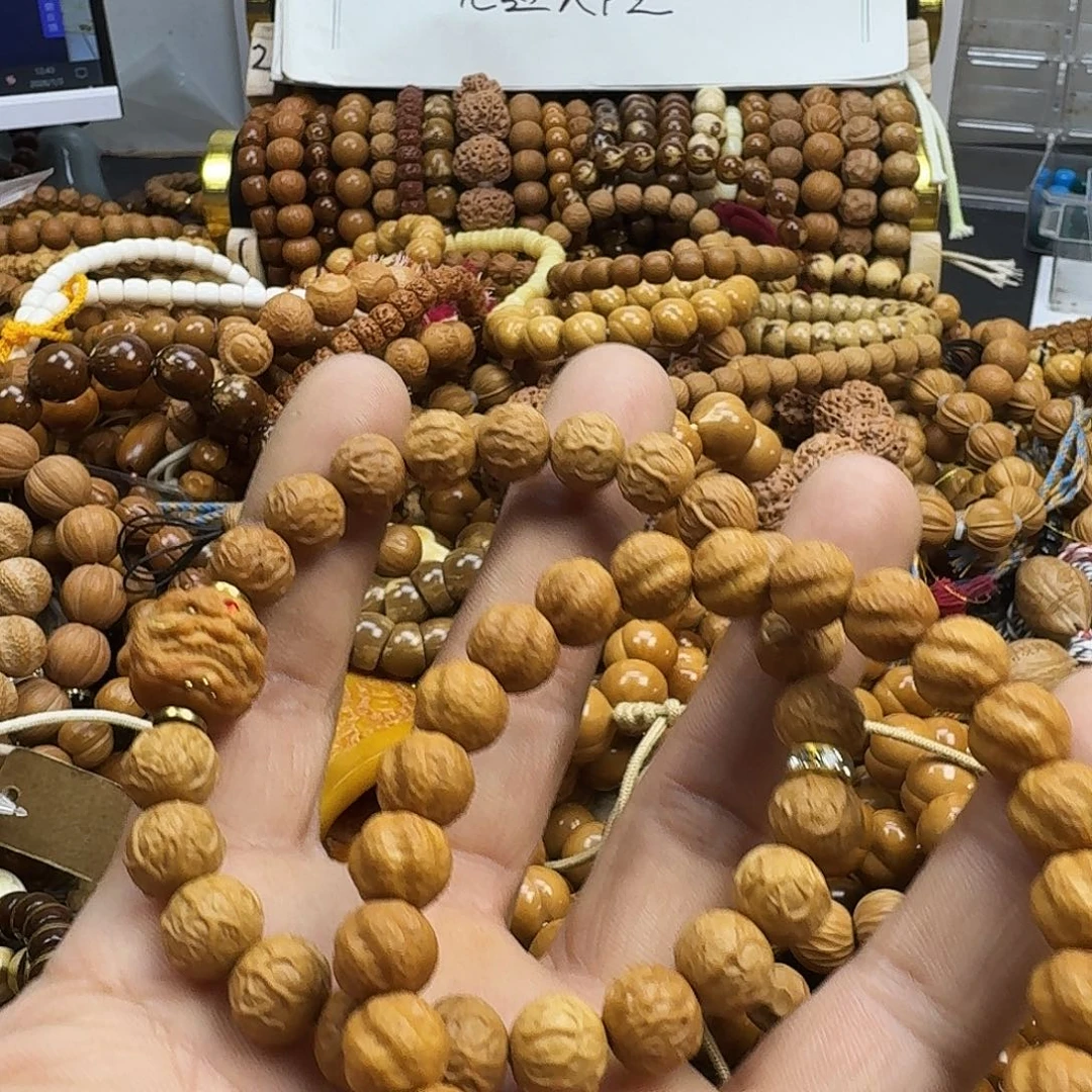 崔***.猴头核桃吊坠微瑕手串两条