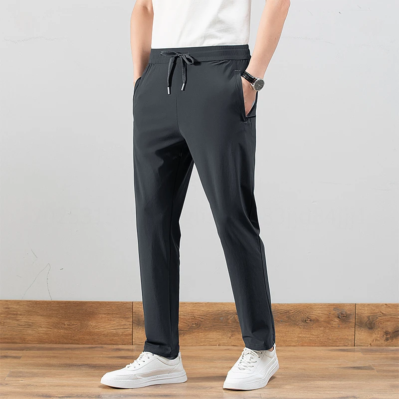 新款透气弹力束脚休闲运动长裤男士春夏薄款九分活力直筒
