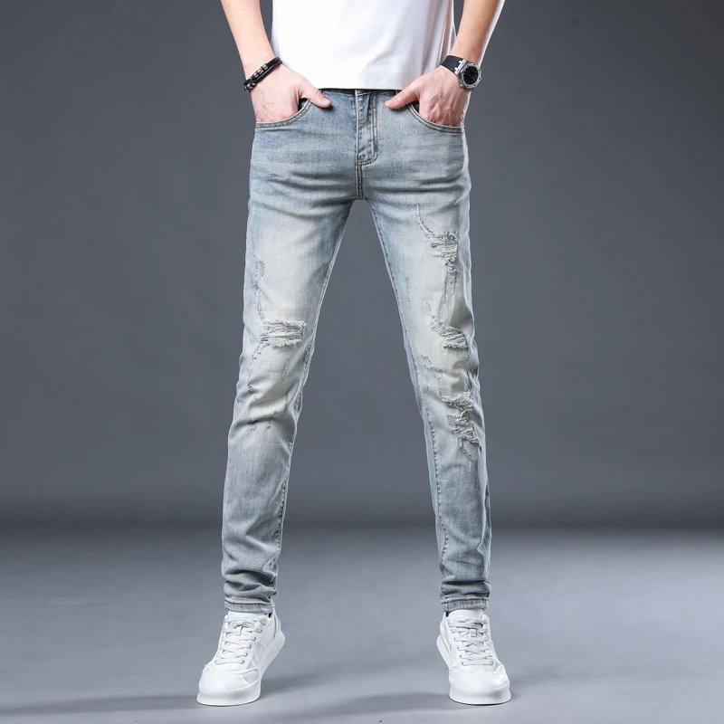 新款牛仔裤潮流破洞潮牌流行修身户外牛小脚牛仔裤男士牛仔