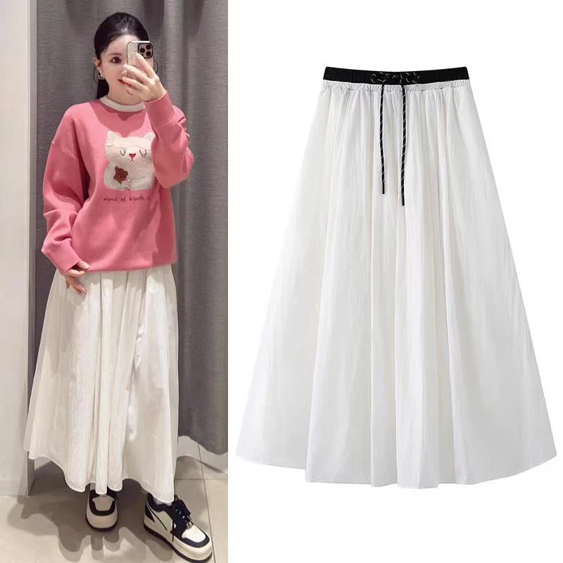 1335春季2025新款宽松简约中长款撞色刺绣A字半身裙女