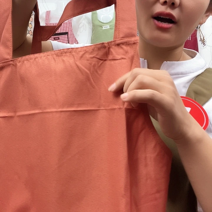 用***࿐帆布橘色背代两件