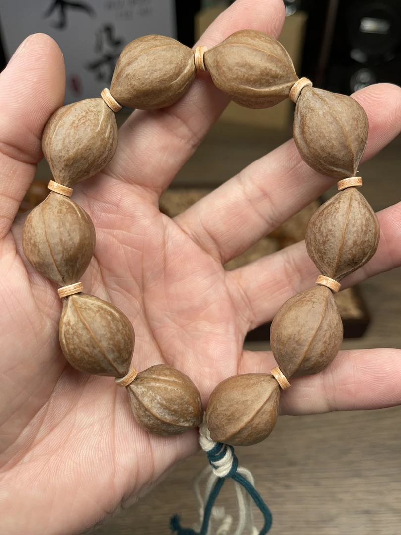 1.7*2.5  尺寸广东梅林铁核橄榄核手串素串抛光去霜打底精品文玩