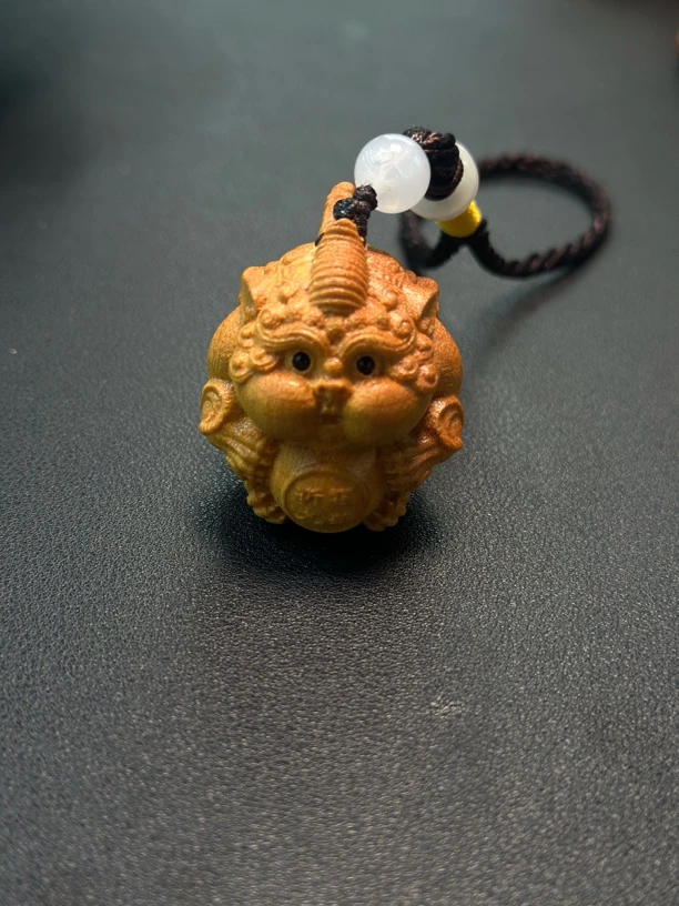 黄檀木雕刻谛听手把件