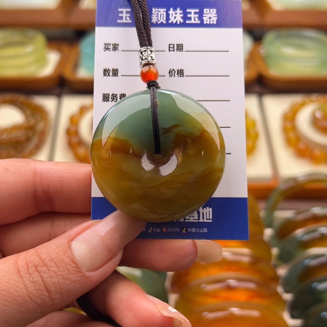江***依蛇纹石玉未镶嵌平安扣