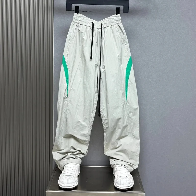 夏季轻薄速干拼接撞色运动休闲弯刀卫裤男女款大码松紧腰阔脚长裤