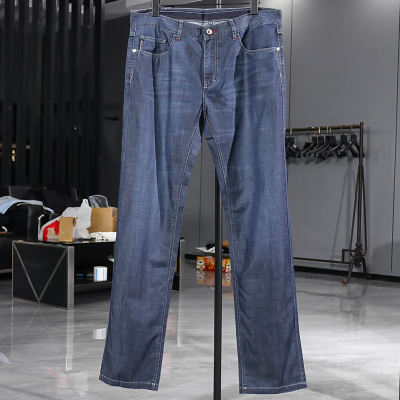 狼家的 春秋新款简约潮流男士尾货百搭时尚修身小直筒牛仔裤3403