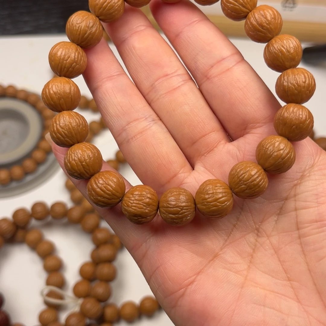 霖***木吊坠猴头核桃凤羽