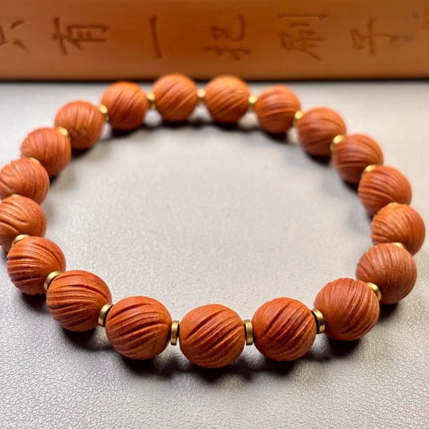 龙纹桃核拉丝定风珠10毫米手串