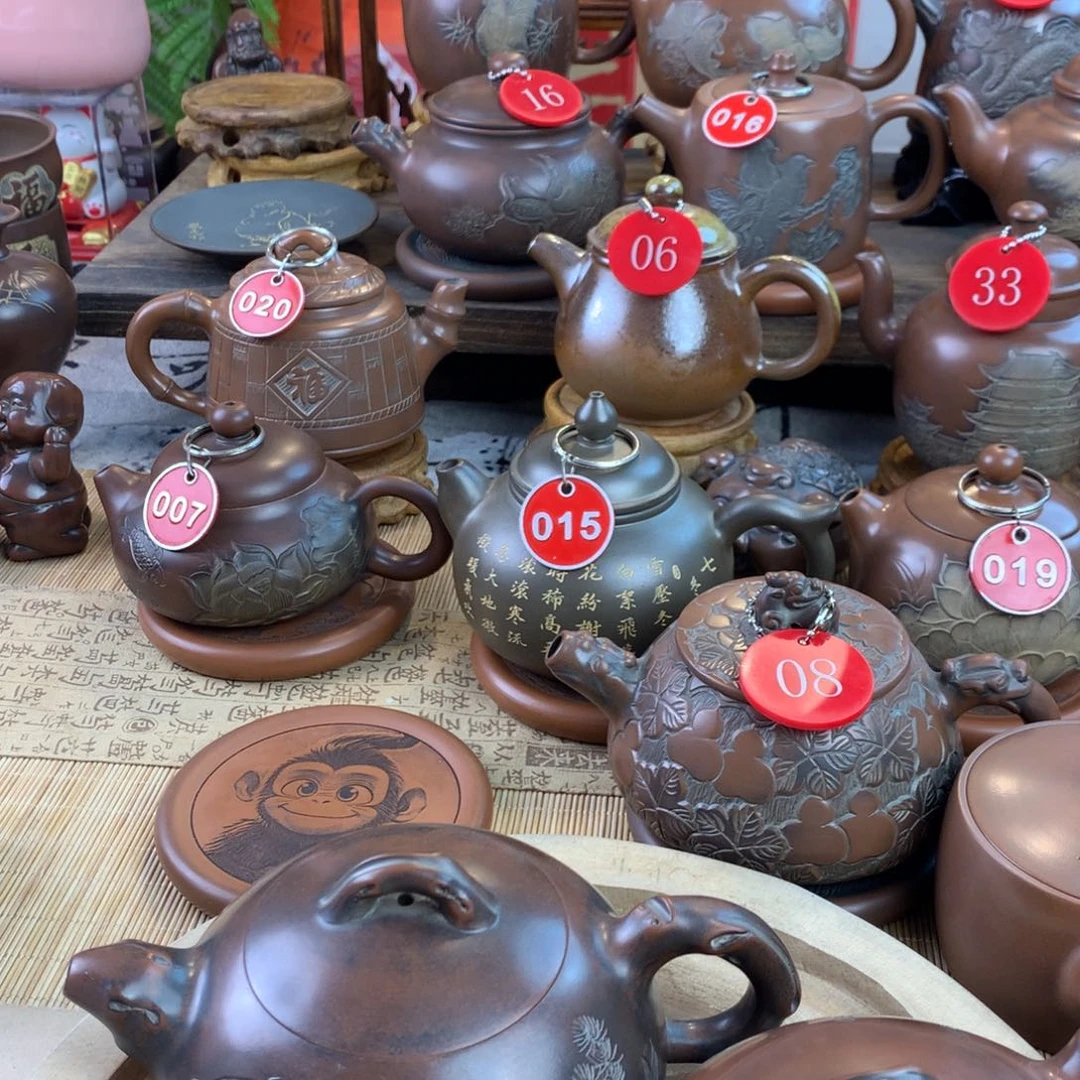 长*弓坭兴陶手工刻绘壶