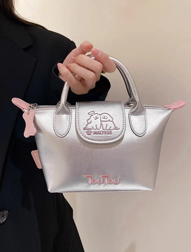 TOU家2025新款线条小狗银色饺子包