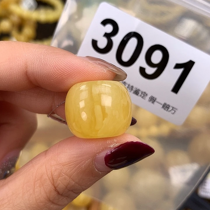 蜜蜡未镶嵌珠宝奇石19.5，高16.2。