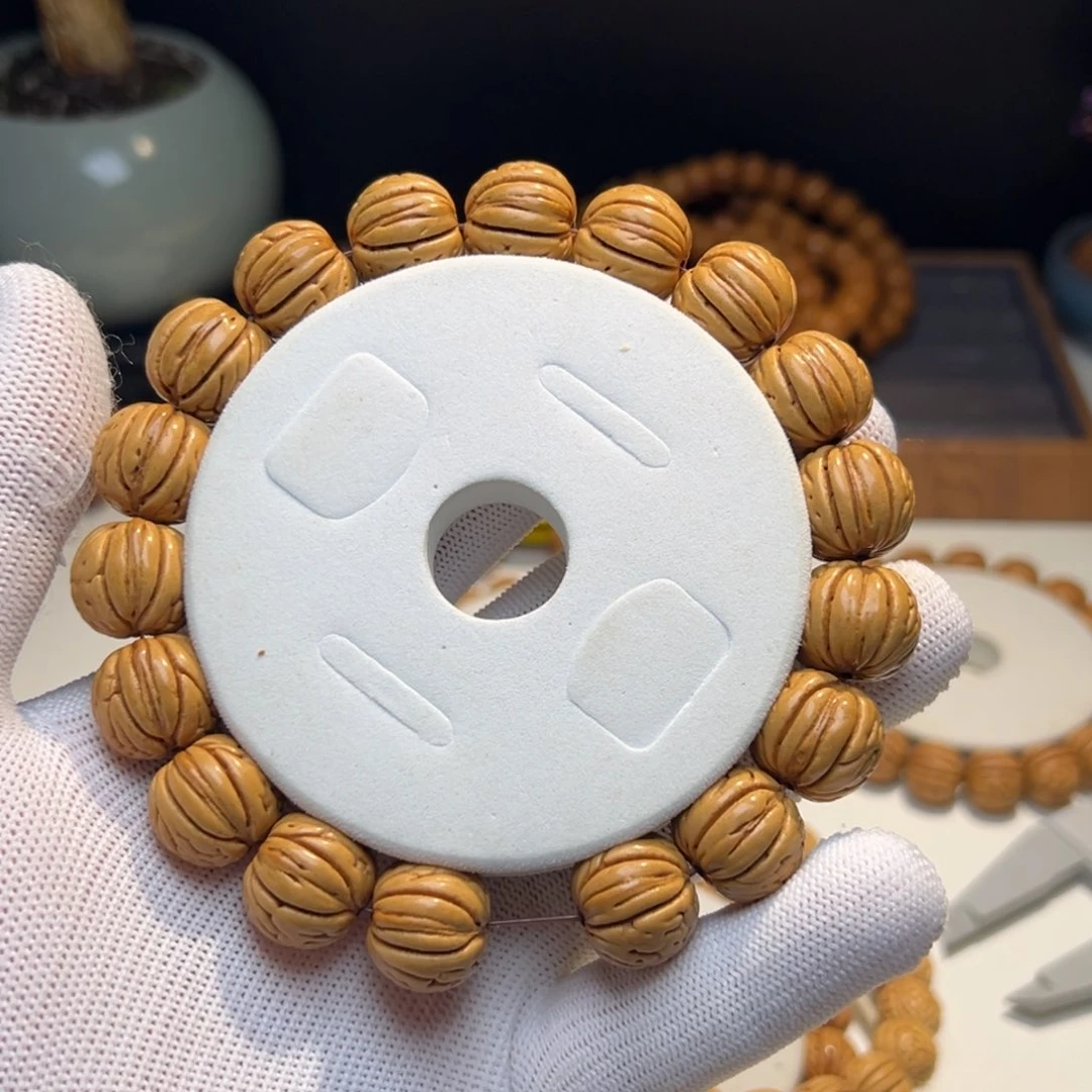 桃核手串吃****楠金丹桃核
