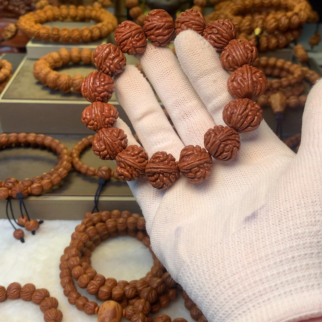 H***z桃核手串秦岭龙纹