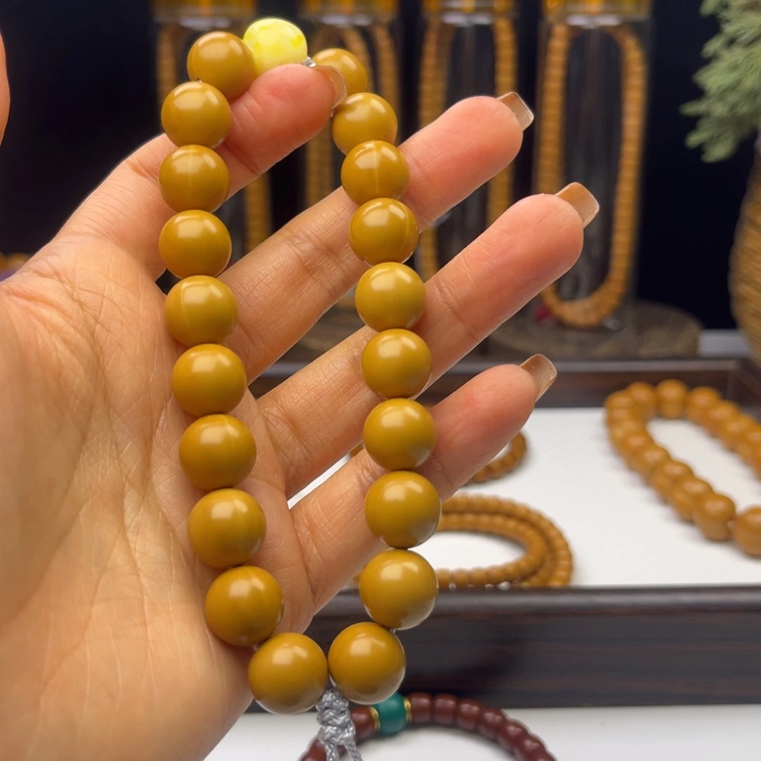 橄榄核吊坠猴头手持