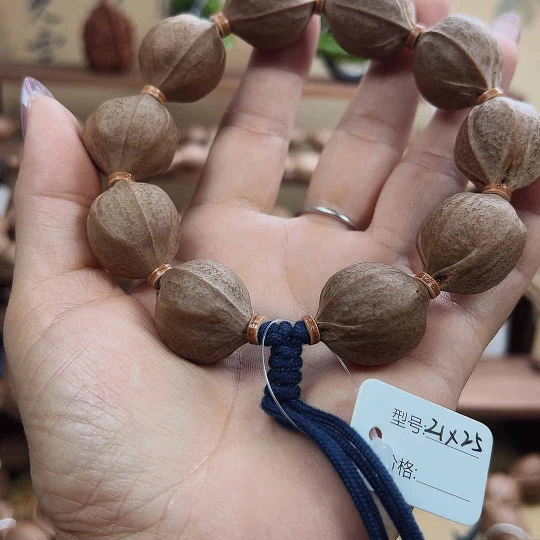 成***屋吊坠橄榄核梅林铁核2125