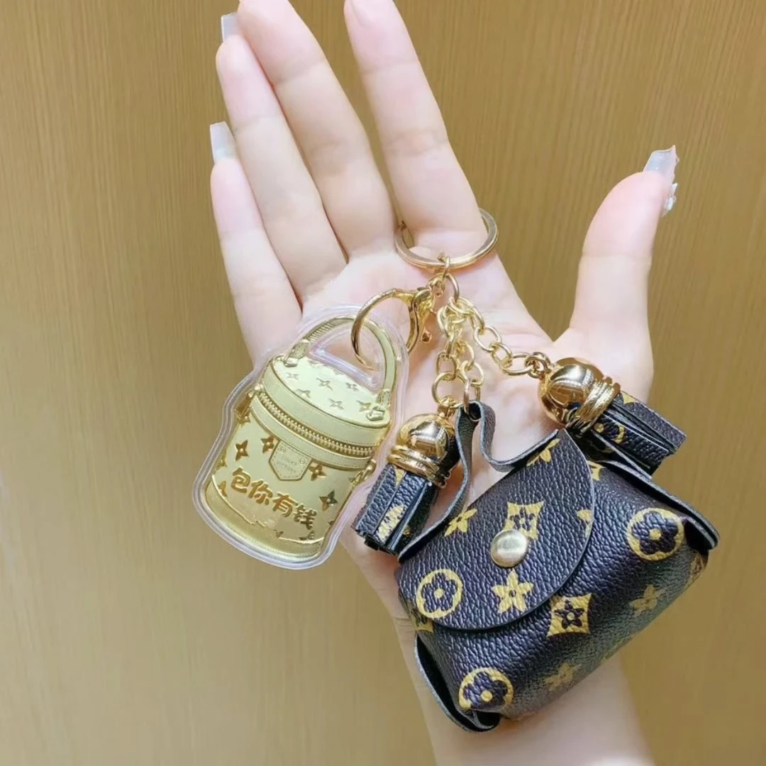 含金工艺品【宝曼珠宝】新款包你有钱手机挂 包挂