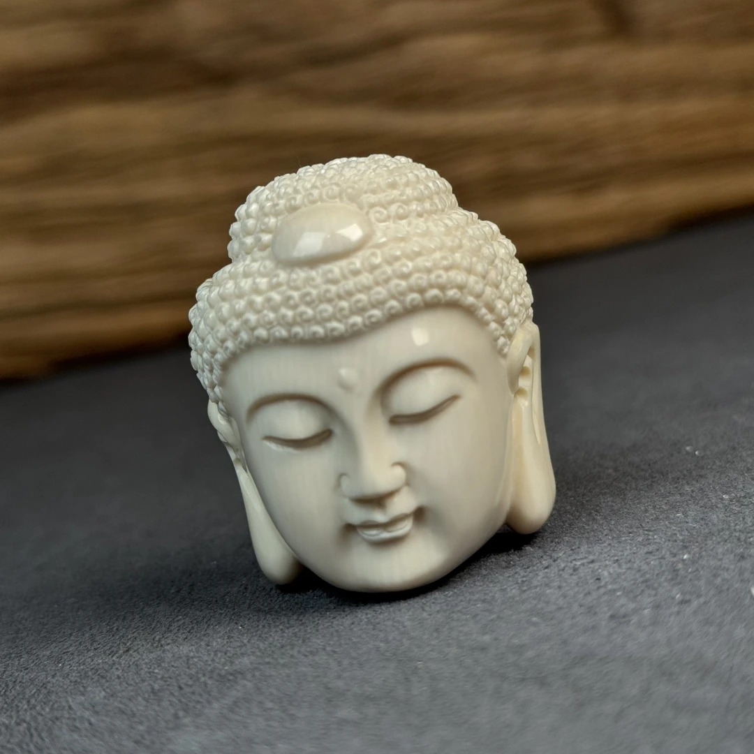 H3223天然猛犸牙 雕刻佛头34*42*25mm支持鉴定 假一罚四