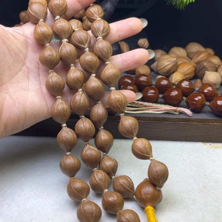 玉***L手串/手链橄榄核1.5*1.9原皮三花铁核脖挂48颗