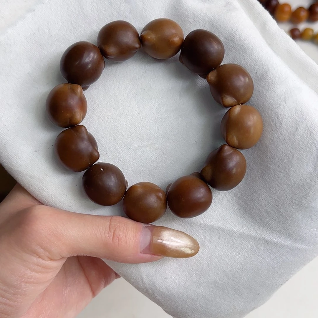 依***恋菩提根/象牙果吊坠干磨18*20mm 猫头瑕疵不补，u52