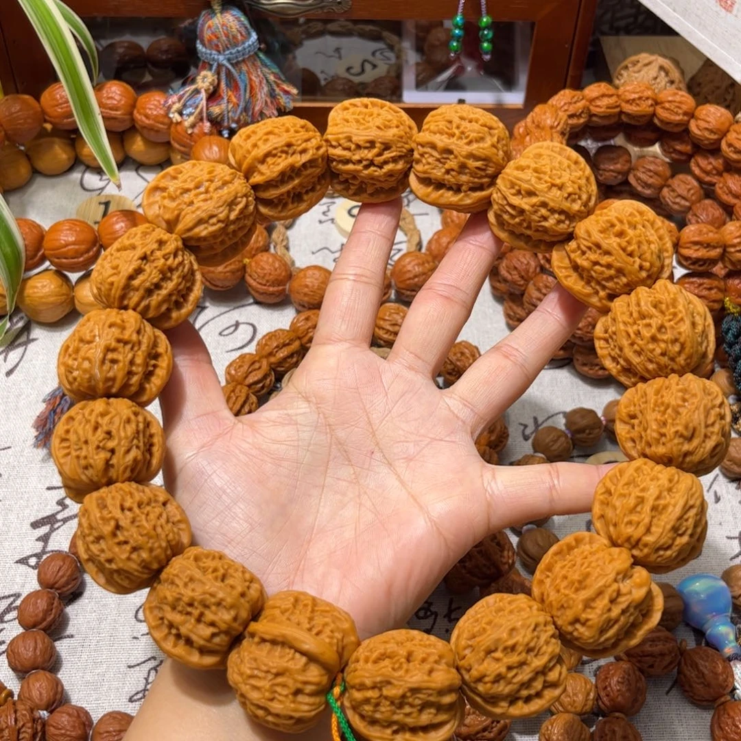 阿***南吊坠桃核白狮子手持