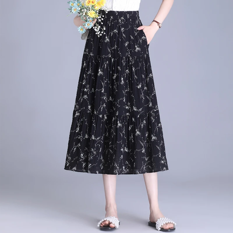 拉夏贝尔碎花半身裙女2025夏季新款松紧腰气质印花薄款a字大摆裙