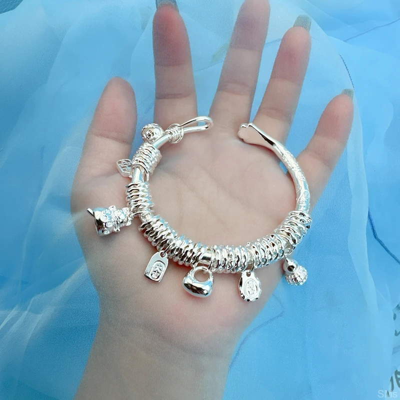 2025新款吉言盘缠手镯带吊坠银9999原创实心猫爪手镯时尚