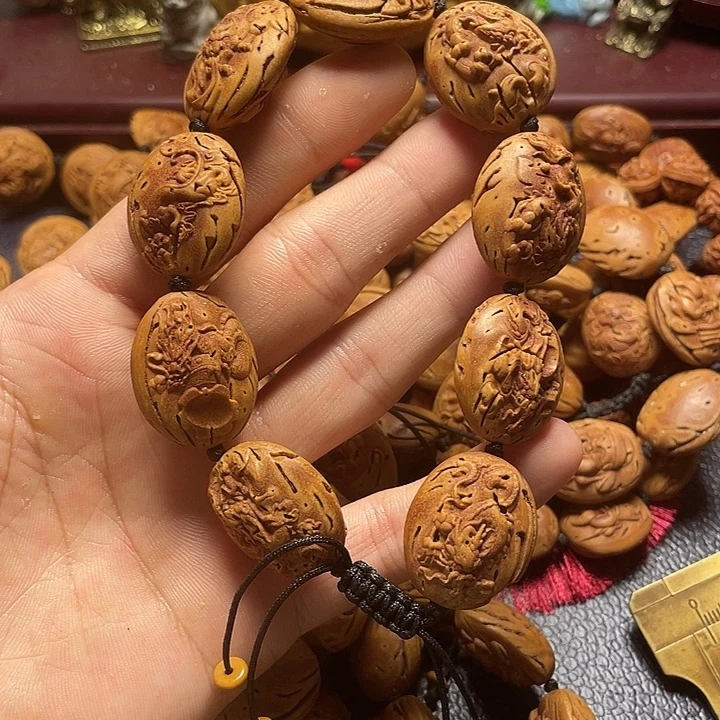 大桃核雕刻瑕疵龙生九子