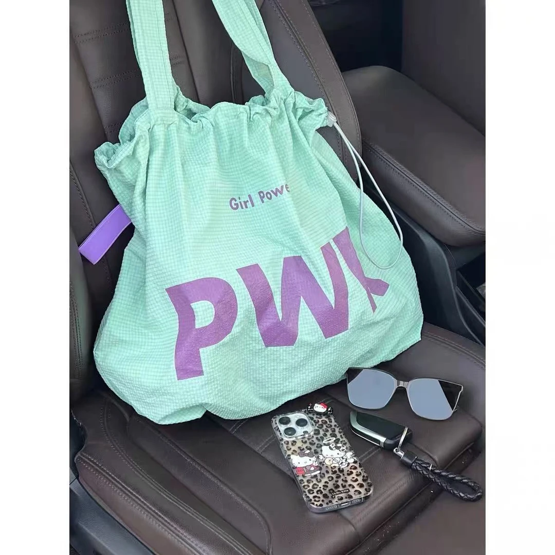 韩系文艺简约抽绳字母尼龙布包2025夏季新款大容量百搭通勤单肩包