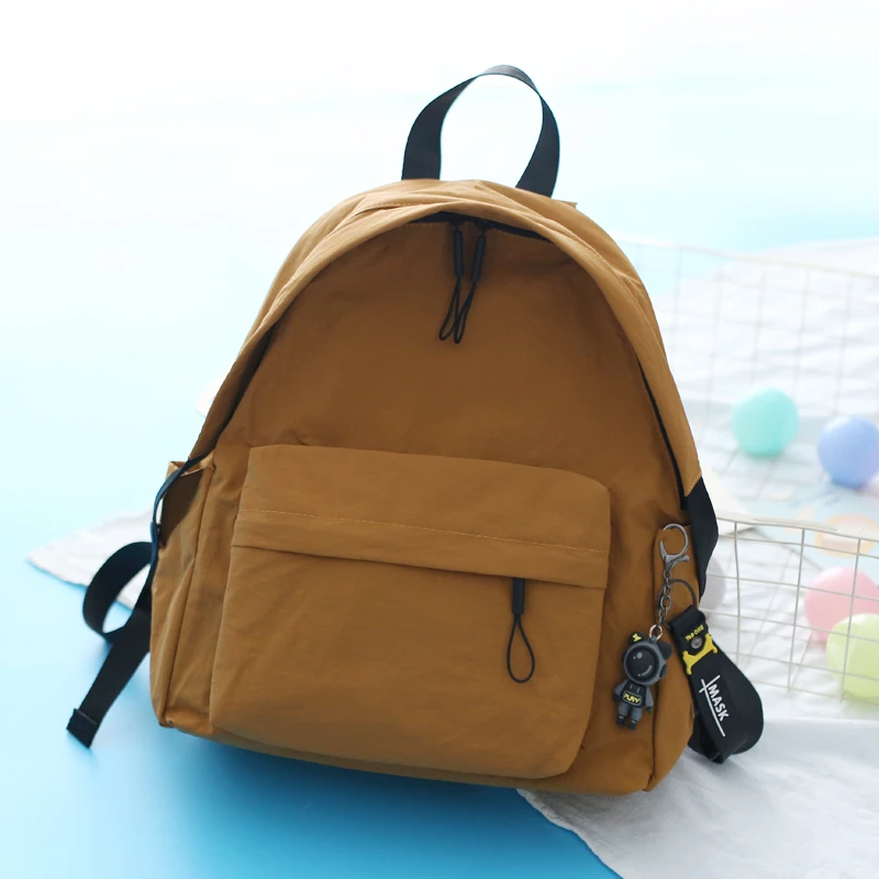 京兔日系简约校园大学生双肩包中号百搭旅游上班通勤背包轻便防水