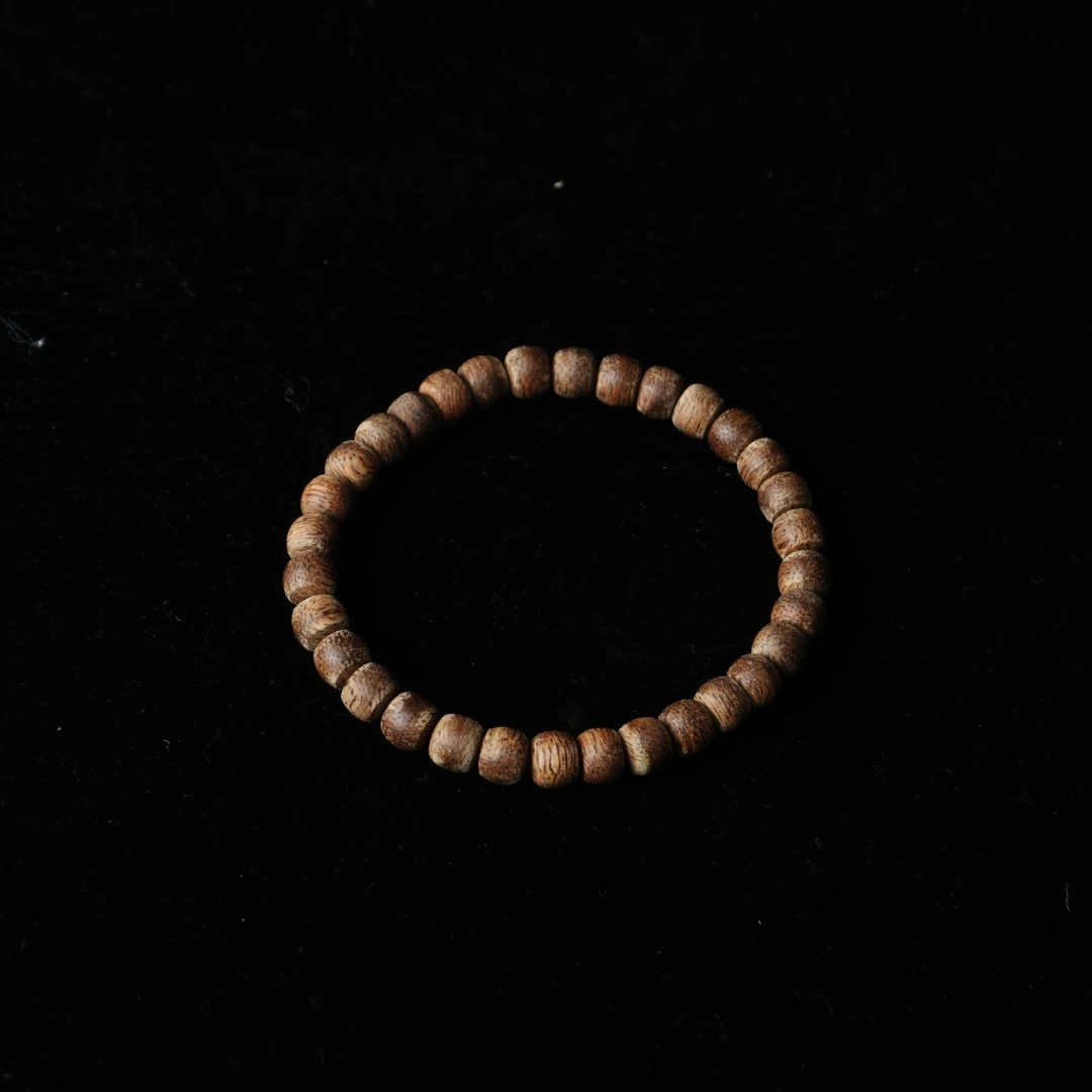 4656 达拉干沉香软丝土沉9分沉老型珠 0.6x0.5cm 2.94g