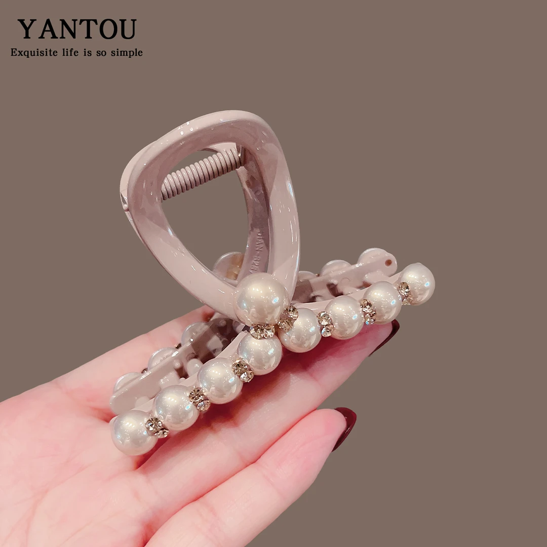 高级感盘发珍珠抓夹女2025新款气质后脑勺网红盘发鲨鱼夹子发饰