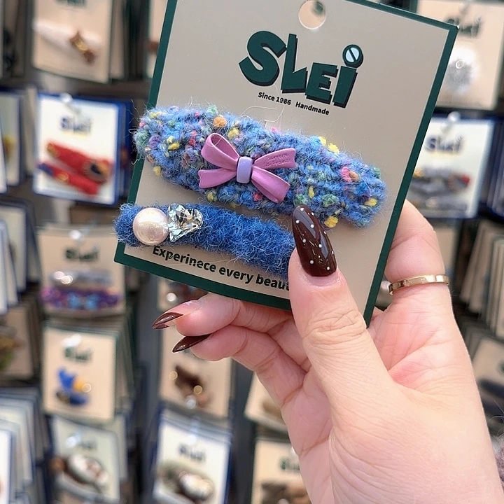 蓝色彩色波点蝴蝶结弯刀