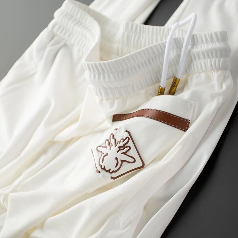 2025新款夏季薄款冰丝白色裤子男修身束脚高端欧货休闲九分裤男士