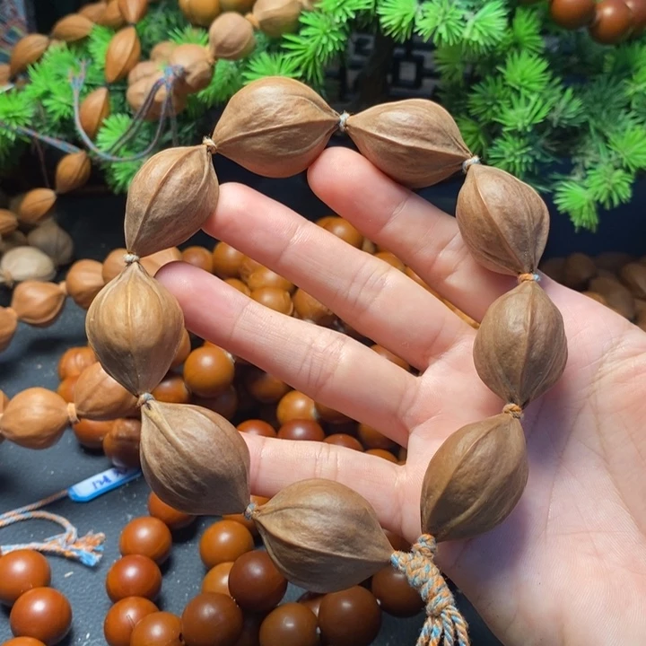张***志手串橄榄核2.4*3.1原籽四花