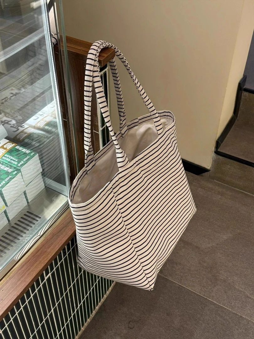 高颜值韩系条纹帆布包女2025新款大容量外出手提通勤托特包购物袋