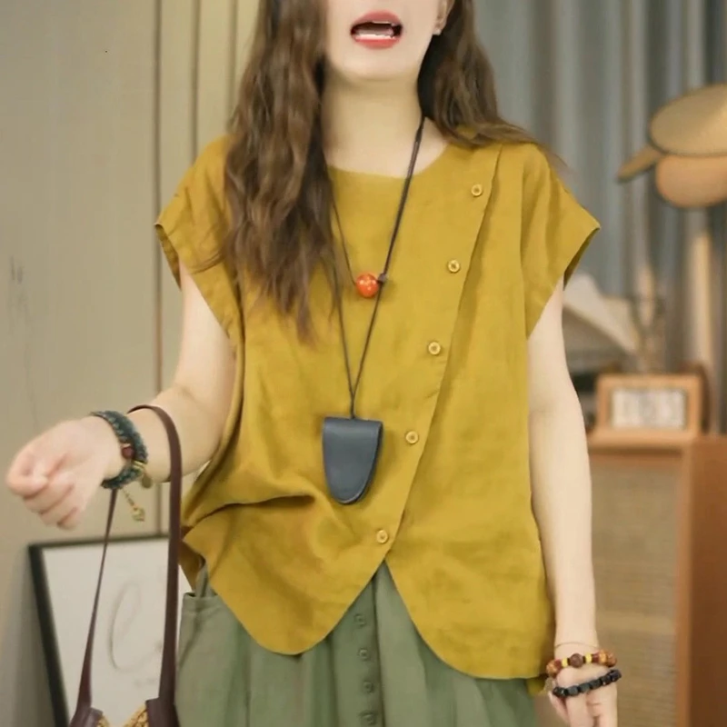 港风文艺圆领短袖衬衫女2025年夏季新款不规则设计纽扣大码上衣潮